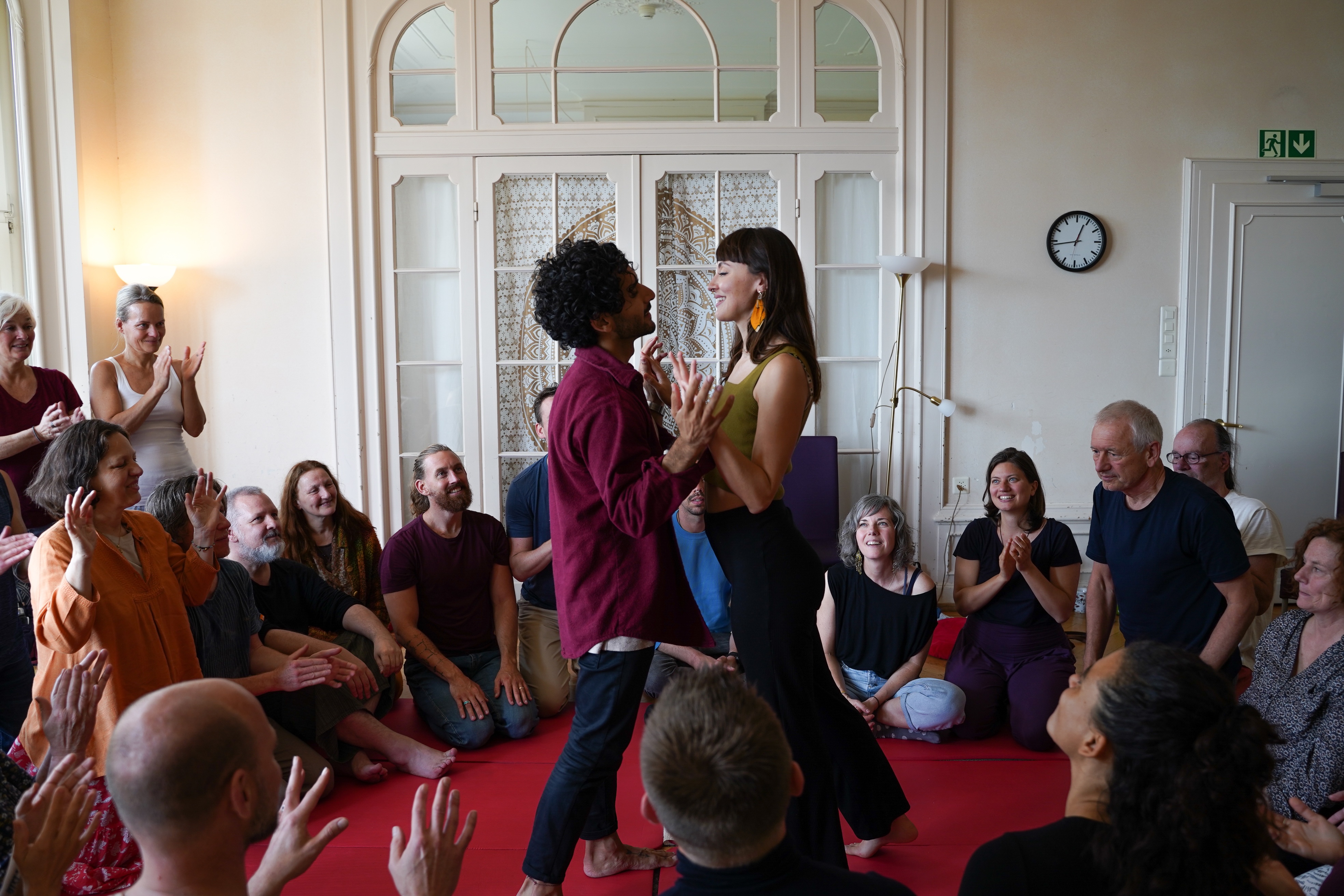 Two participants meeting each other in the centre of a Love, Relationships and You circle